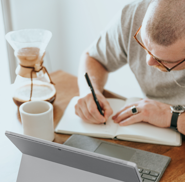 Man writing in notebook